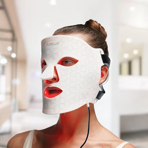 The Red Light Store AURELUX white 368 LED face mask for skin rejuvenation with red light therapy on a woman
